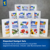 Verschiedene Saatgut-Set Verpackungen mit Garten- und Blumenmotiven auf einem Tisch, darunter Text.
