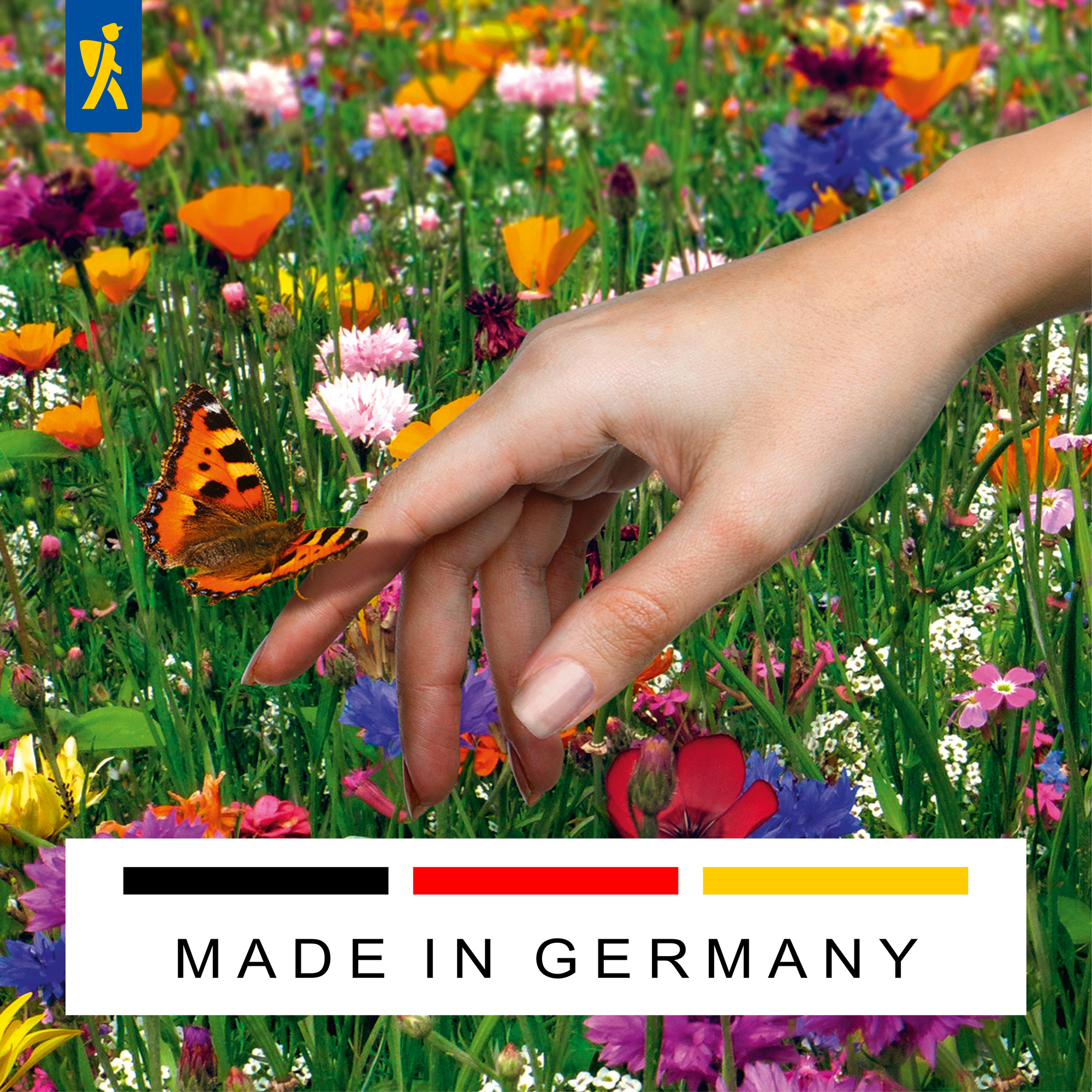 Hand berührt orange und schwarz gefärbten Schmetterling im bunte Blumenfeld.