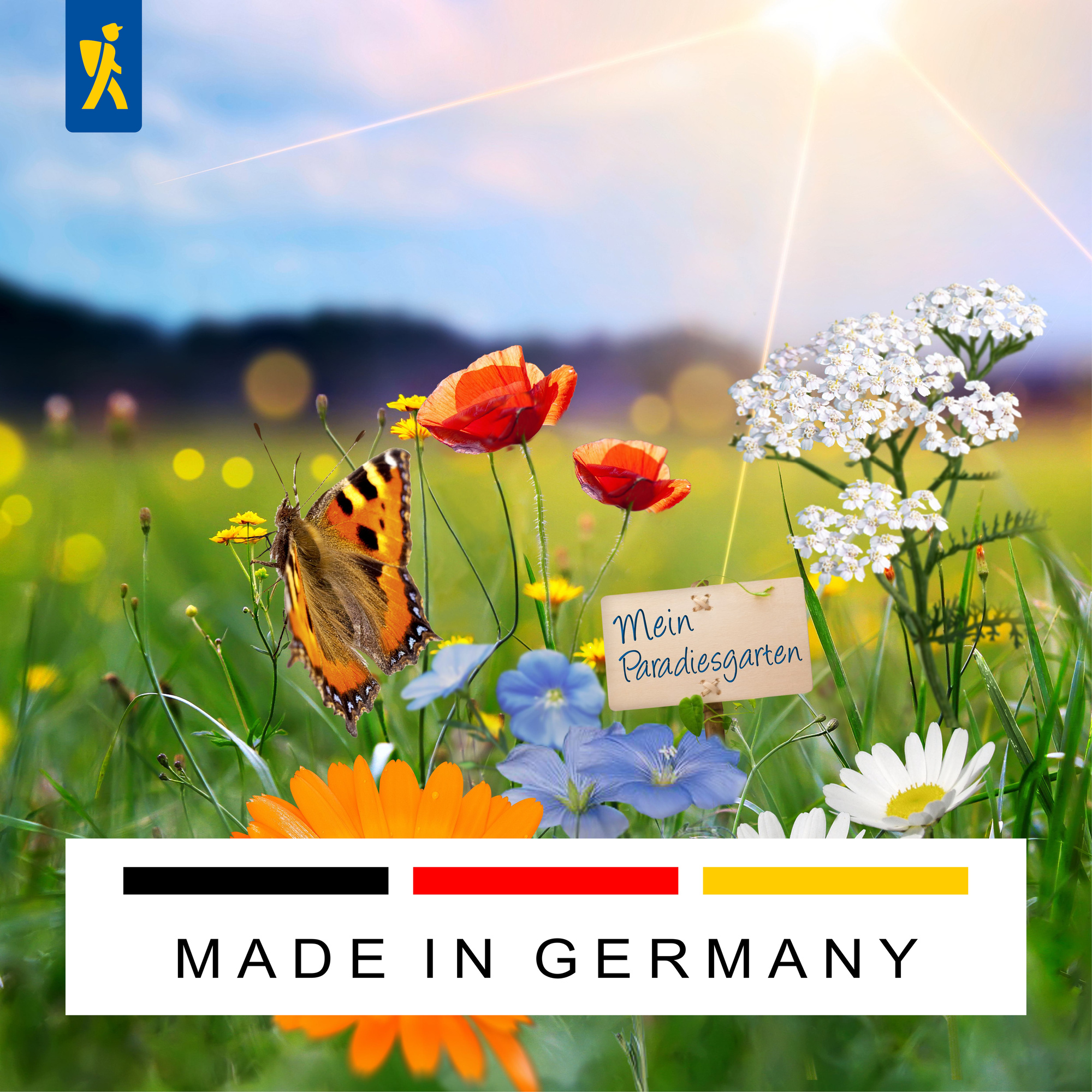 Bunte Blumenwiese mit Schmetterling, weißem Klee, Mohn, Gänseblümchen, darunter ein Schild mit "Mein Paradiesgarten"