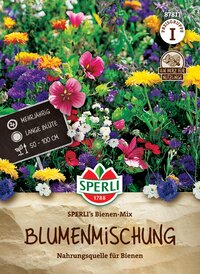Bunte Blumen und Pflanzen in einem Blumenbeet, mit einem Schild und Wasserzeichen des Herstellers.